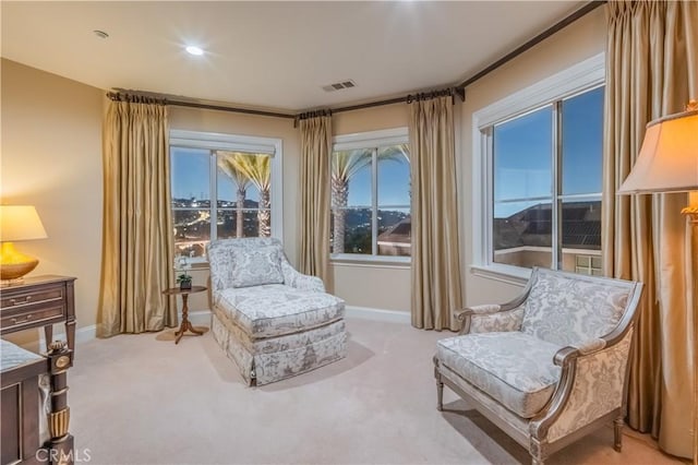 sitting room with light colored carpet