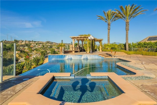 view of pool with an in ground hot tub, a pergola, and a patio area