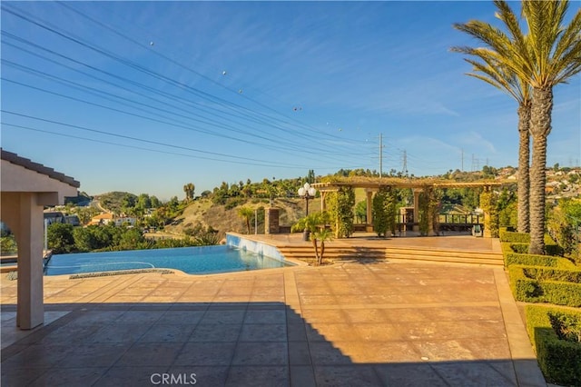 view of swimming pool featuring a patio