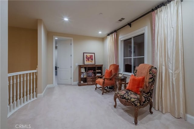 sitting room with light carpet