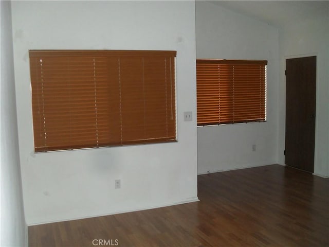 empty room with wood finished floors