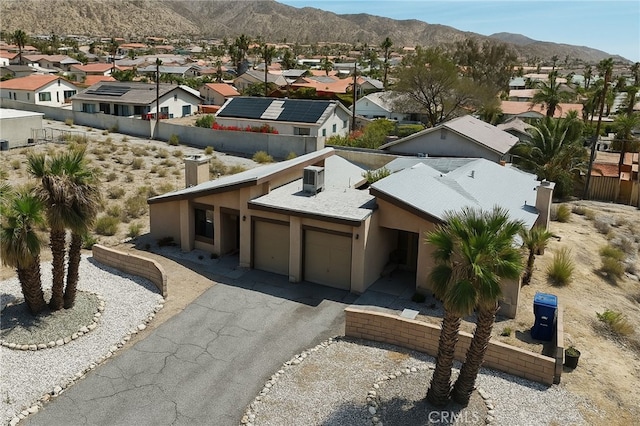 birds eye view of property with a residential view and a mountain view