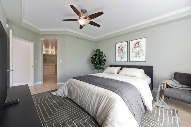 bedroom featuring light tile patterned floors, ensuite bathroom, a ceiling fan, and crown molding