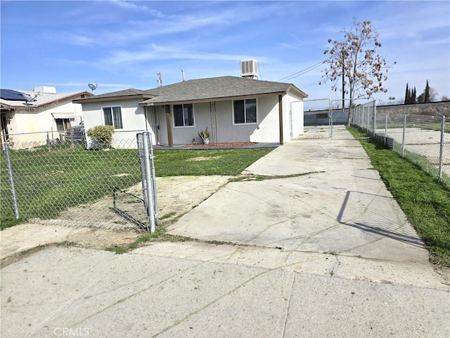 view of front of home featuring a front yard and central air condition unit