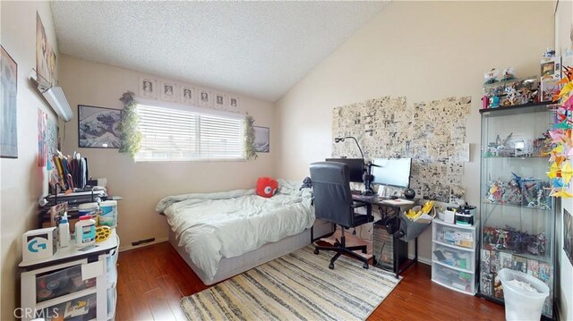 11214 Fineview Unit 5, El Monte, CA 91733 - bedroom featuring lofted ceiling, dark wood-style flooring, and a textured ceiling