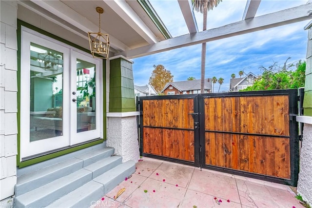 exterior space featuring entry steps and french doors