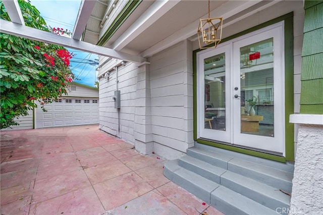 view of exterior entry featuring french doors