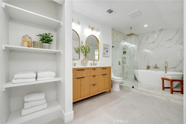 full bath featuring a freestanding tub, toilet, a sink, visible vents, and a marble finish shower