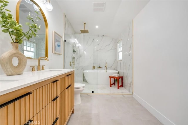 full bath featuring a marble finish shower, plenty of natural light, a sink, and toilet