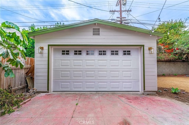 detached garage with fence