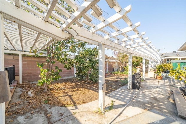 view of patio / terrace featuring a fenced backyard and a pergola