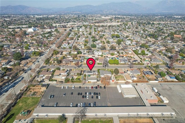 birds eye view of property featuring a mountain view