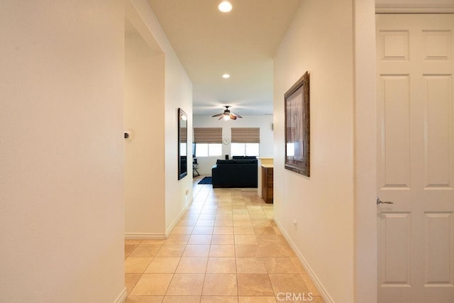 corridor featuring light tile patterned floors