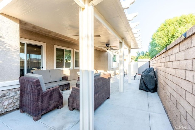 view of patio featuring an outdoor living space, ceiling fan, and area for grilling