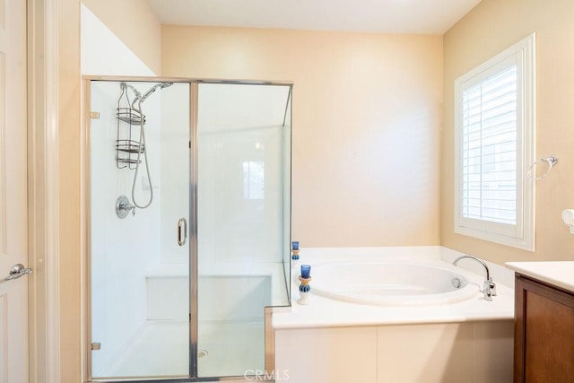 bathroom with plus walk in shower and vanity