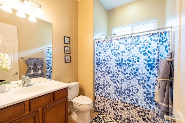 bathroom featuring tile patterned flooring, an inviting chandelier, toilet, vanity, and a shower with shower curtain