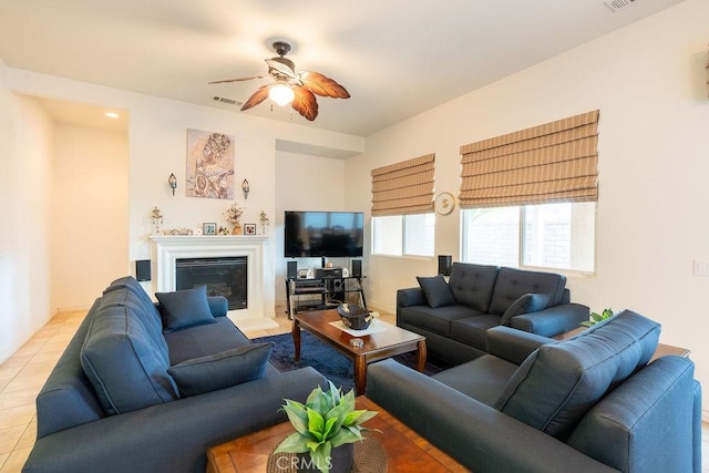 tiled living room featuring ceiling fan