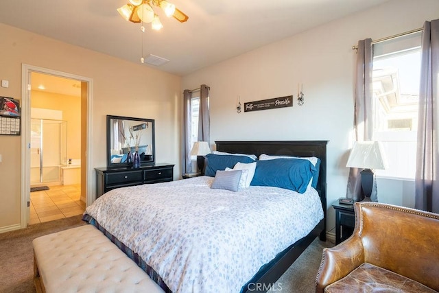 bedroom featuring ensuite bathroom, ceiling fan, and carpet floors