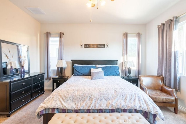 bedroom with light colored carpet