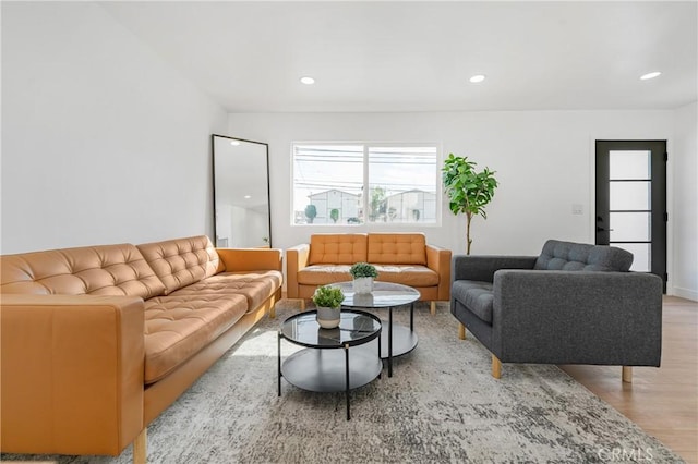 living room with light wood-style floors and recessed lighting