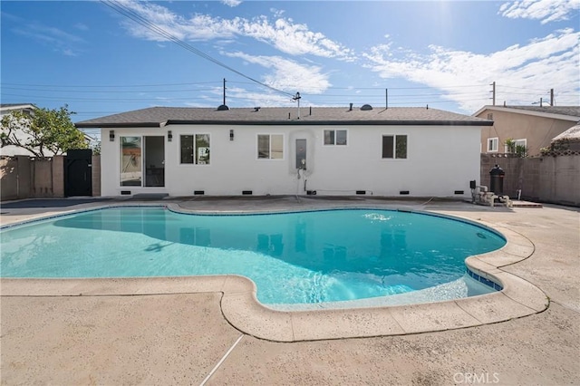 view of swimming pool with a fenced in pool, a patio area, and fence