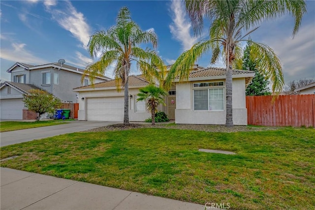 view of front of home featuring a front lawn and a garage