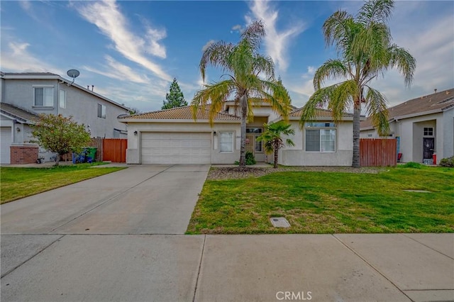 view of front of house with a front yard and a garage