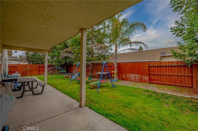 view of yard featuring a patio and a playground