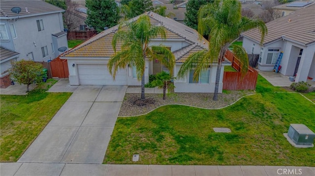 view of front facade with a front yard and a garage