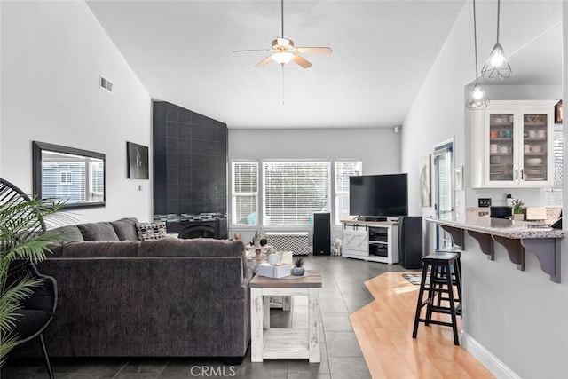 living room with visible vents and ceiling fan