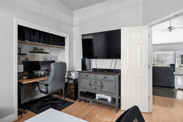 office with wood finished floors and a ceiling fan