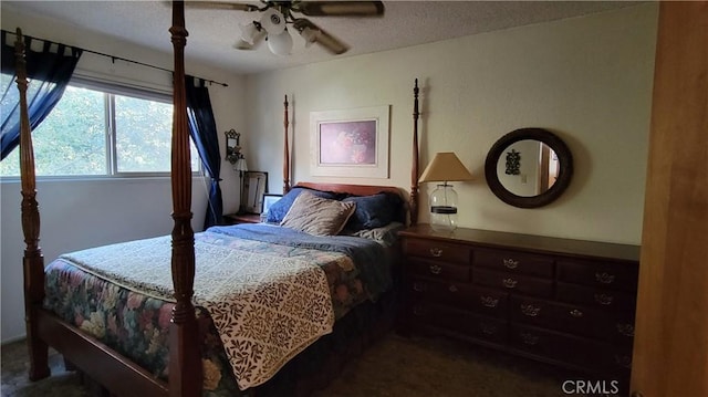 1239 Yosemite Dr, Lake Arrowhead, CA 92352 - bedroom featuring dark carpet, a textured ceiling, and a ceiling fan