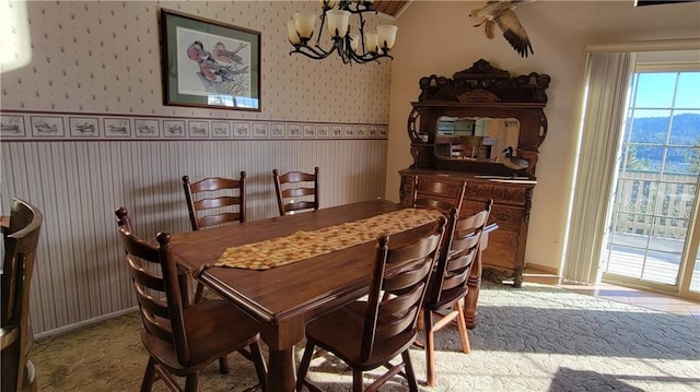1239 Yosemite Dr, Lake Arrowhead, CA 92352 - dining area featuring a chandelier, wallpapered walls, and baseboards