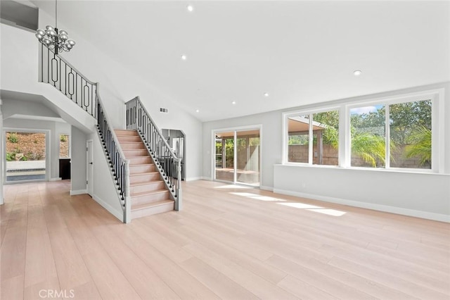 unfurnished living room with light wood-style floors, stairs, baseboards, and recessed lighting