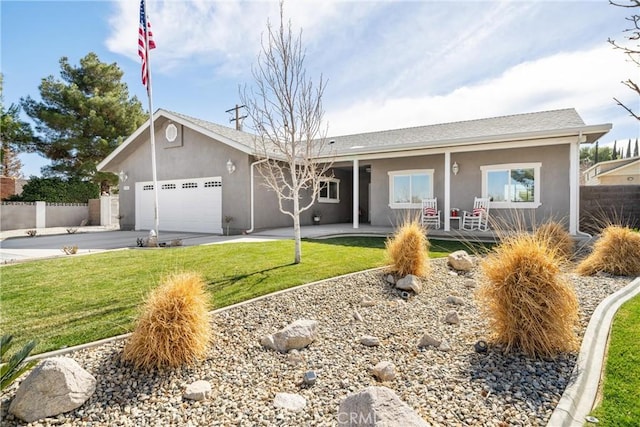 single story home with stucco siding, concrete driveway, a front yard, fence, and a garage