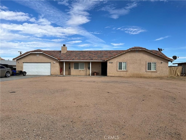 single story home featuring a garage