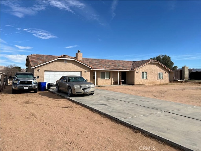 single story home featuring a garage