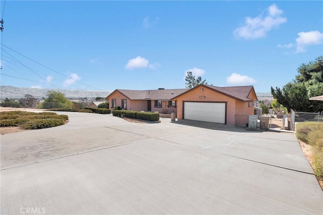 single story home featuring a garage