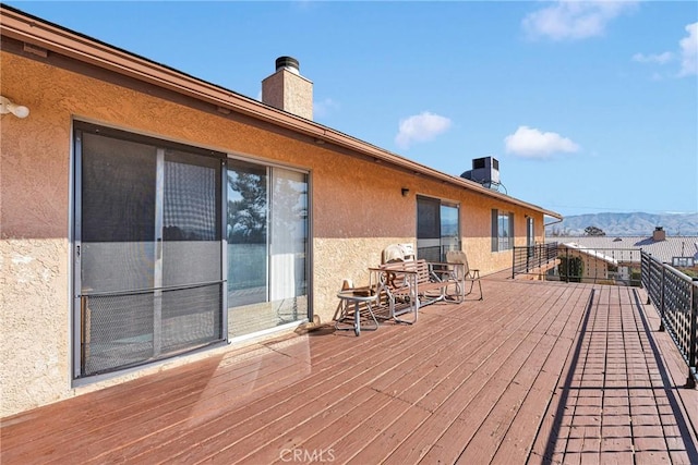 wooden terrace with a mountain view