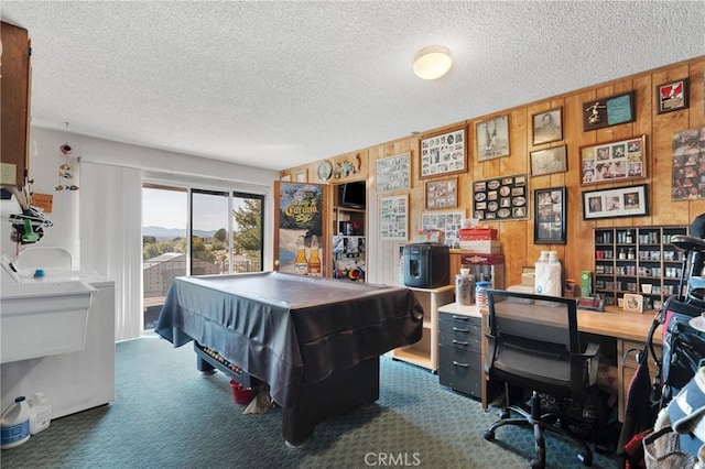 rec room featuring pool table, dark colored carpet, and a textured ceiling