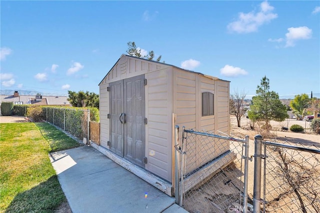 view of outbuilding with a lawn