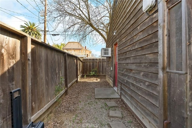 view of side of home with a fenced backyard