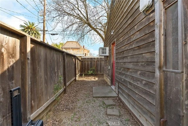 view of property exterior with a fenced backyard