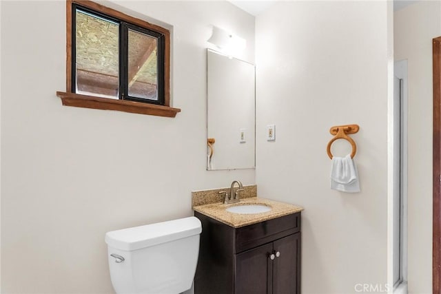 bathroom with toilet and vanity