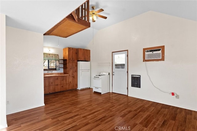 kitchen with a wall mounted AC, white appliances, dark wood-type flooring, a ceiling fan, and brown cabinets