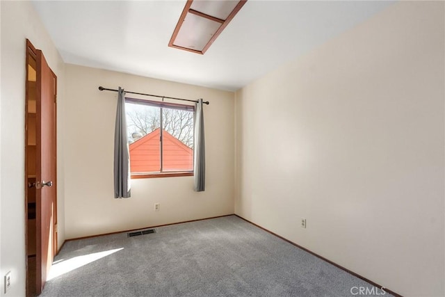 carpeted spare room with visible vents