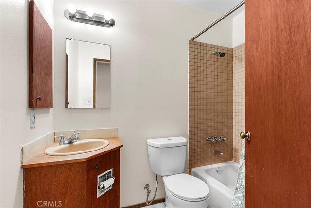 full bath with toilet, vanity, and shower / bathtub combination