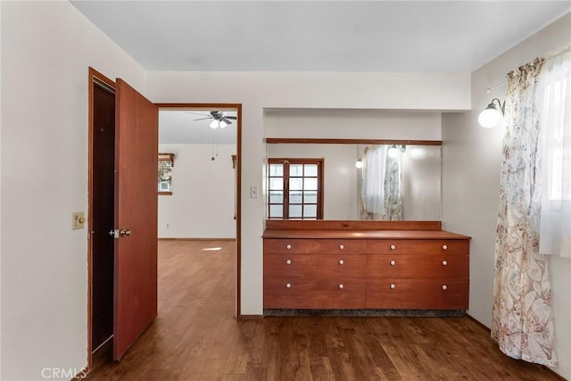 hallway with dark wood-type flooring