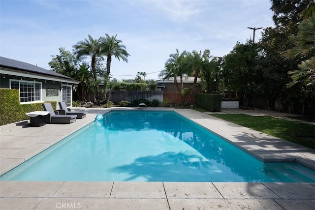 view of pool with a fenced in pool, a fenced backyard, and a patio