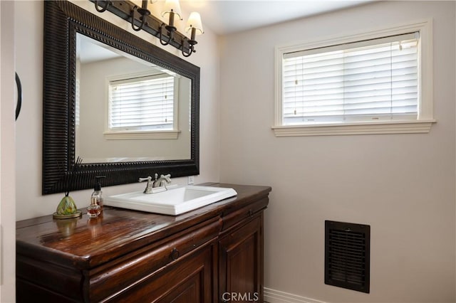 bathroom with visible vents and vanity